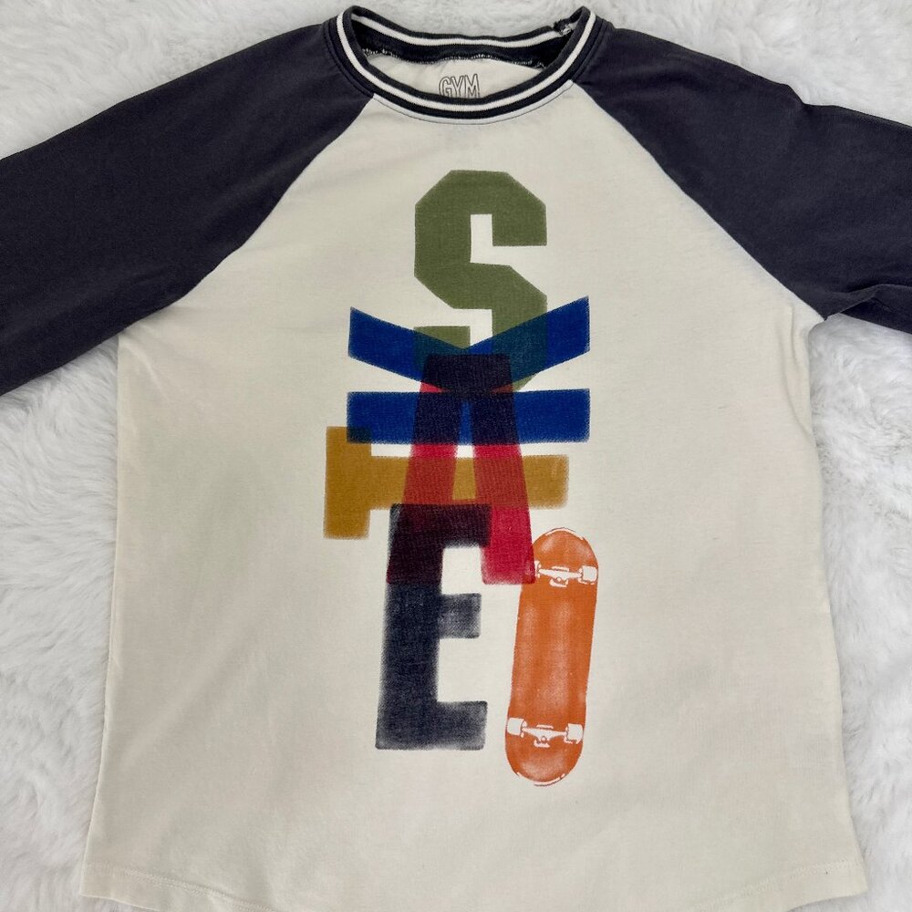 Gymboree boys’ long-sleeve raglan shirt featuring a fun and colorful “SKATE”